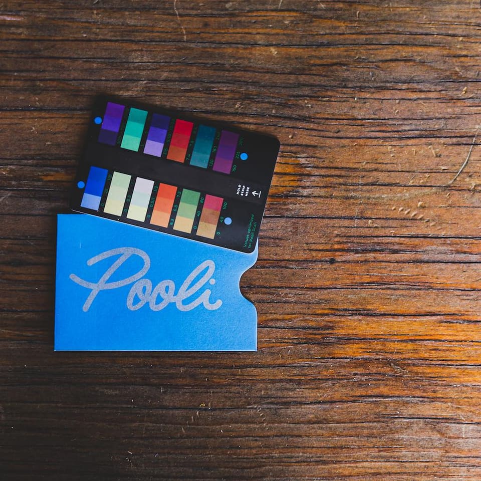 Pooli Color Correct card resting on its blue Pooli sleeve.